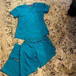 Med couture teal scrubs.